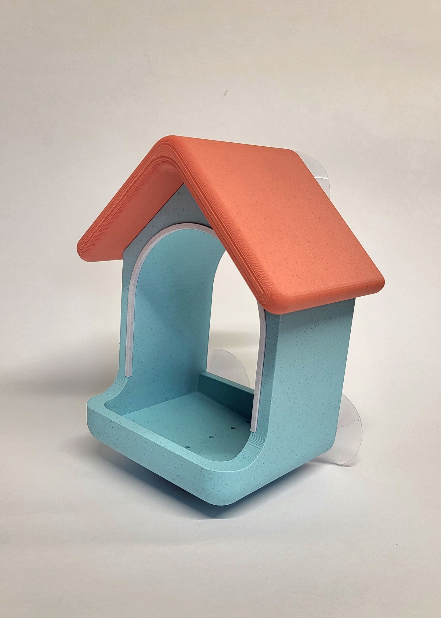 Ptičja hiška – hranilnica za okno s priseski